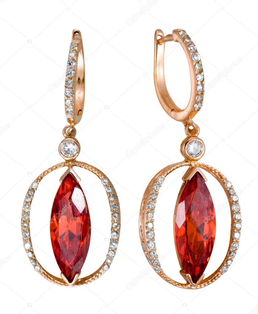 Earrings with red zircon isolated