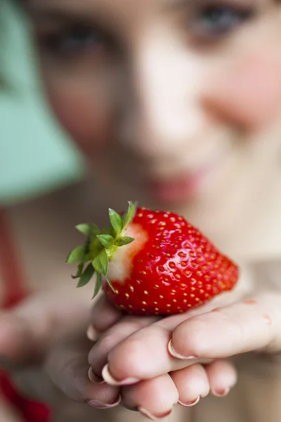 stock image Girl with a fresh juicy strawberry