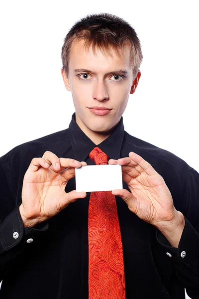 Fiatal üzletember tart egy üres névjegykártya — Stock Fotó