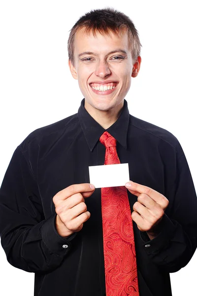 Young businessman holds an empty business card — Stock Photo, Image