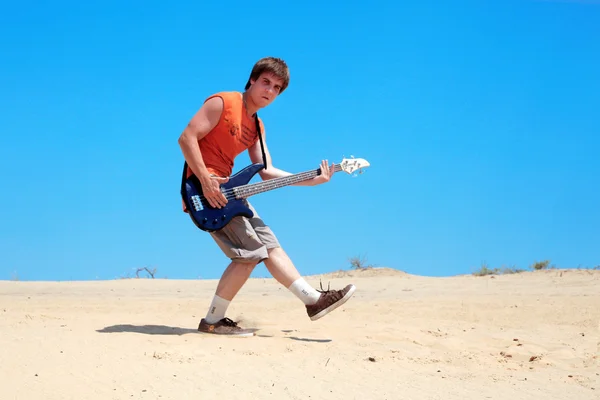 stock image Young man with guitar jumping