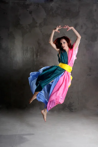 stock image Young dancing girl in colorful dress