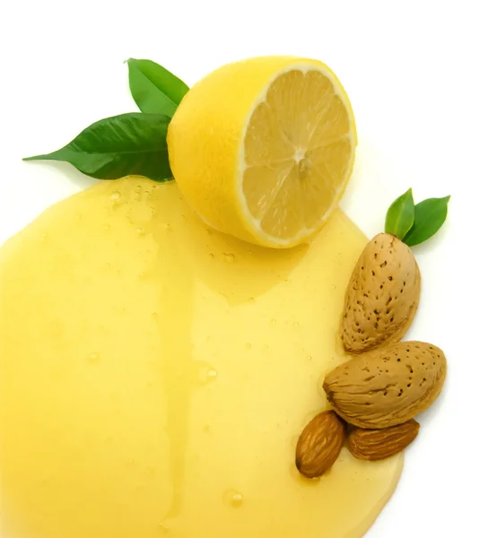 Almonds with honey and lemon — Stock Photo, Image