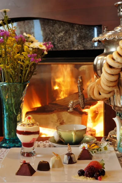 Tea drinking at a fireplace — Stock Photo, Image