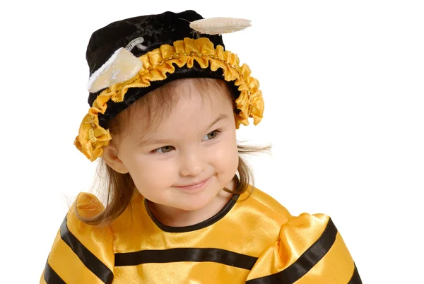 Den lilla flickan i klänning av ett bi — Stockfoto