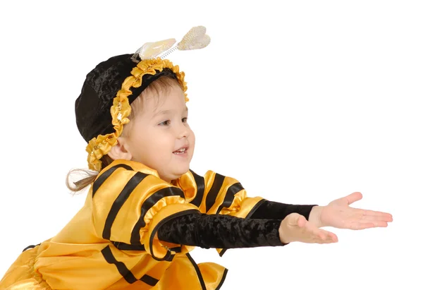 Den lilla flickan i klänning av ett bi — Stockfoto