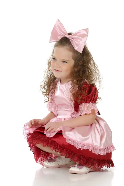 Het kleine meisje in een feestelijke kleding — Stockfoto
