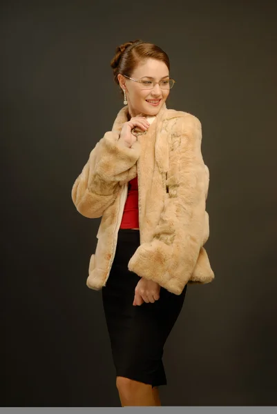 Stock image The girl in a fur coat