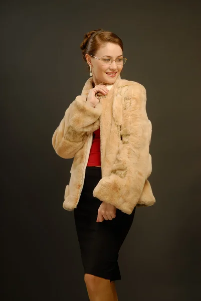 stock image The girl in a fur coat