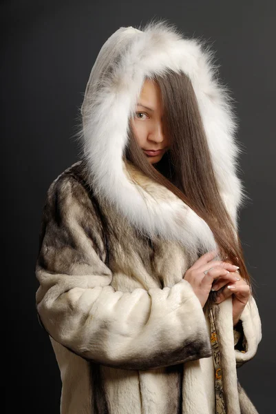 stock image The girl in a fur coat