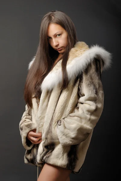 stock image The girl in a fur coat