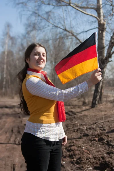 Дівчина з прапором Німеччини — стокове фото