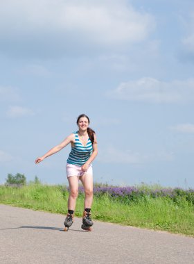 Young girl on rollerblades clipart