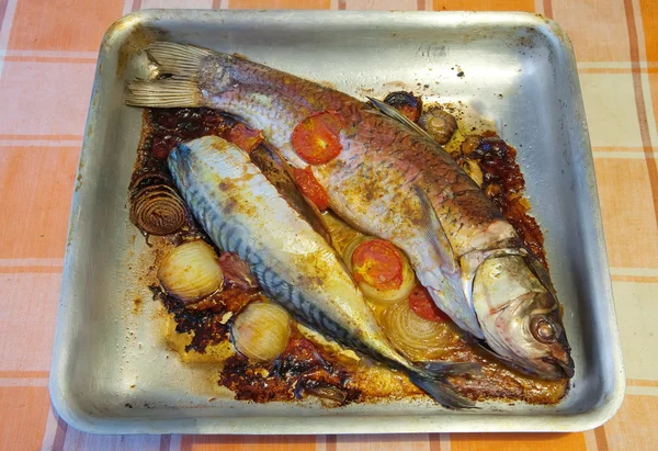 Fried fish on griddle — Stock Photo, Image