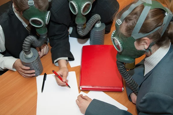 Businessmans in a gas mask — Stock Photo, Image