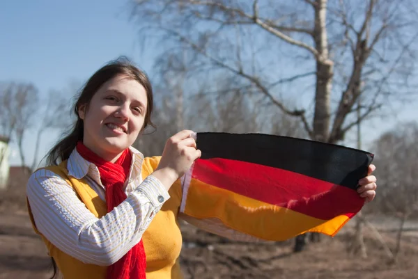 Dívka s vlajkou Německa — Stock fotografie