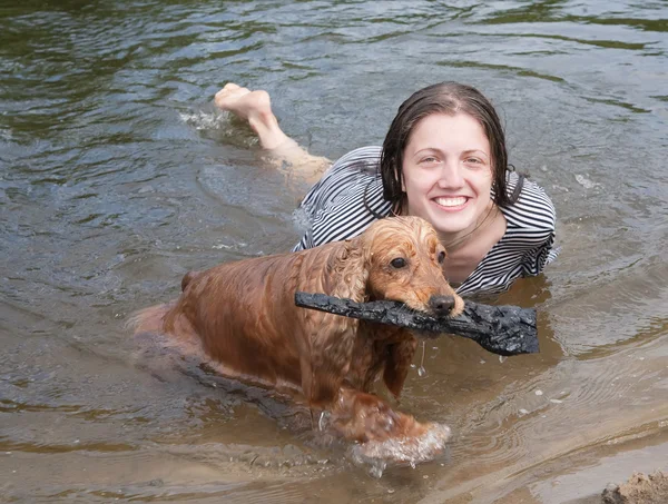 stock image Girl and dog plays