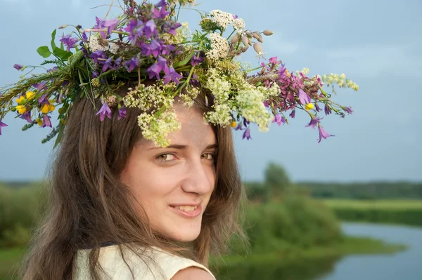 Girl in flower chaplet — Stock Photo, Image