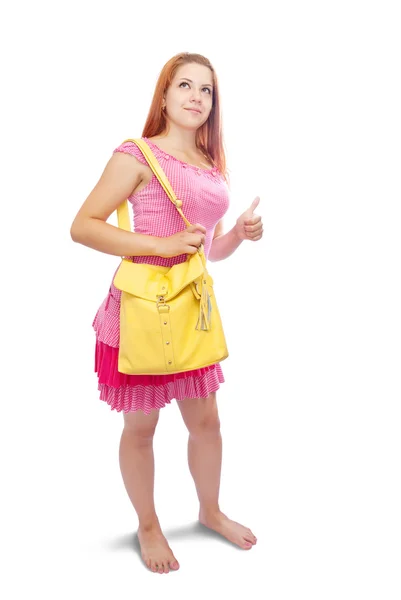 Menina com bolsa apontando para longe — Fotografia de Stock