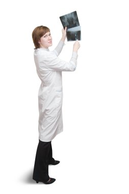 Female doctor looking at an x-ray clipart