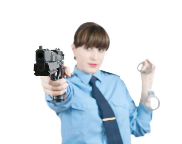 Žena v uniformě s pistolí — Stock fotografie