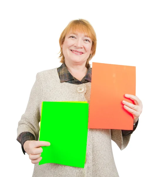 Smiling senior woman holding posts — Stock Photo, Image