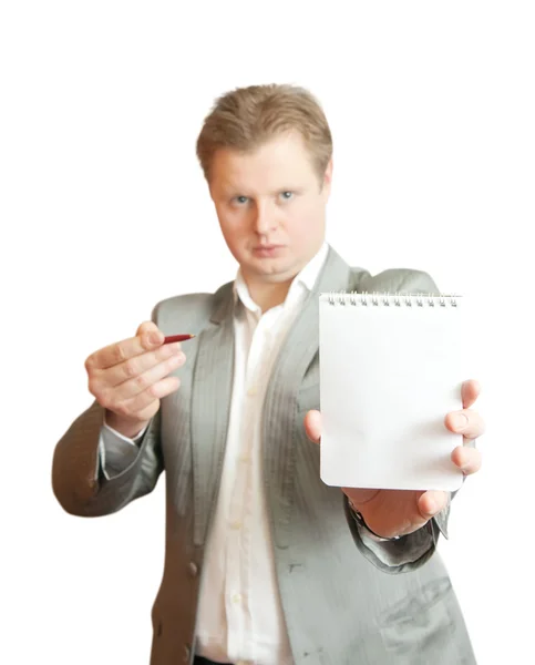 Biznesmen, wskazując na puste notatnik — Zdjęcie stockowe