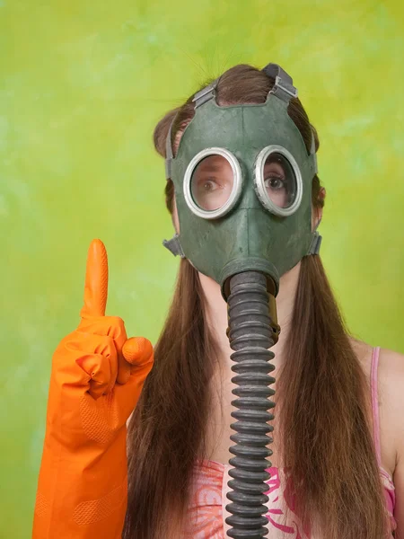 Girl in gas mask pointing ATTENTION — Stock Photo, Image