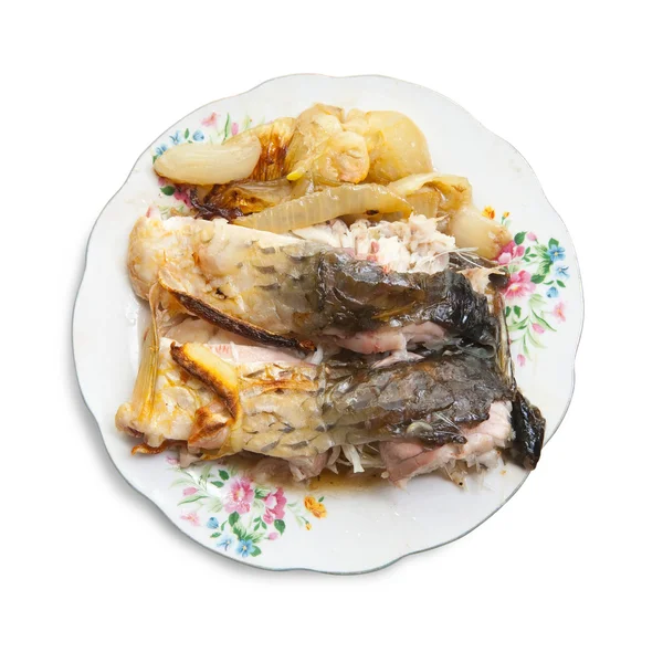 Cooked fish on the plate over white — Zdjęcie stockowe