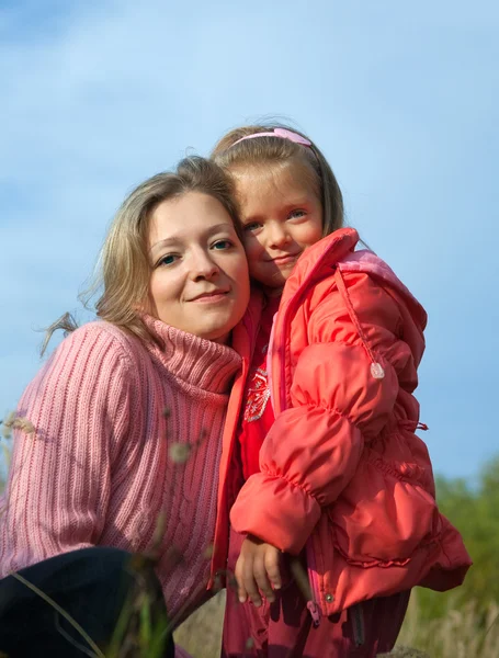 Woman with daughter in fall — Stock Photo, Image