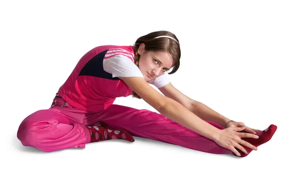 Flicka i rosa sportkläder utövar — Stockfoto