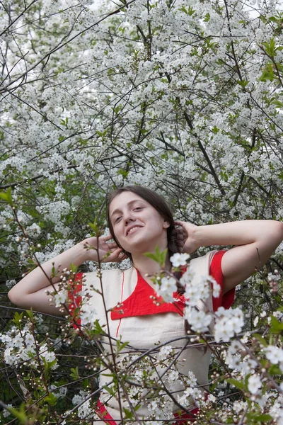 Girl in a spring garden — Stock Photo, Image