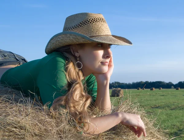 Girl on fresh hay — Stock Photo, Image
