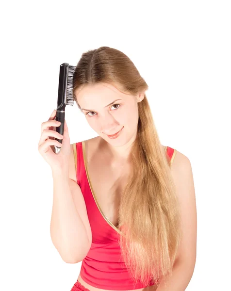 Dívka česání dlouhé vlasy — Stock fotografie