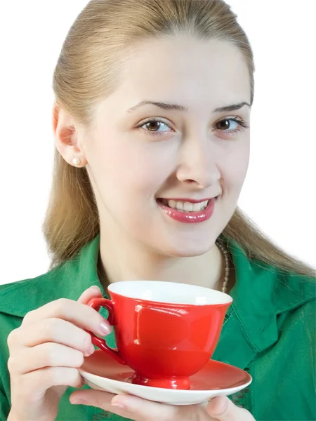 Girl drinks tea from a red cup — Stock Photo, Image