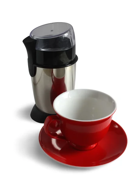 Elektrický mlýnek na kávu a červené víčko — Stock fotografie