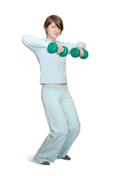 Chica en ropa deportiva está haciendo fitness —  Fotos de Stock