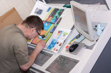 Printer checking a print run clipart