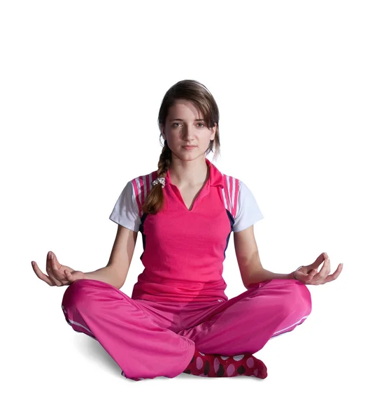 Meisje in roze activewear doen yoga — Stockfoto
