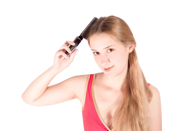 Menina penteando seu cabelo longo — Fotografia de Stock