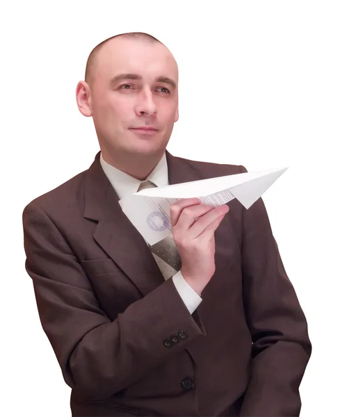 Бизнесмен с бумажным самолетом — стоковое фото