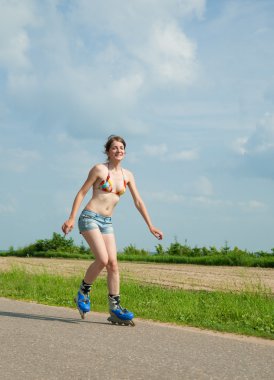 Young girl on roller blades clipart