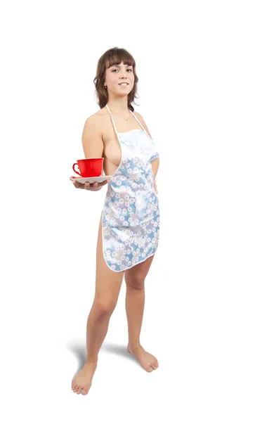 Chica en mono babero con taza de té —  Fotos de Stock
