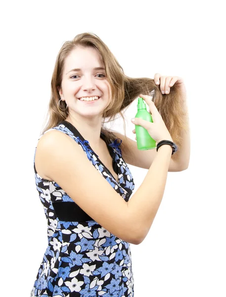 Menina morena com spray de cabelo — Fotografia de Stock