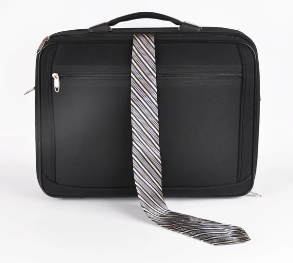 Resväska med en sticker ut slips — Stockfoto