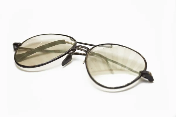 Oude brillen met de krassen bril Stockafbeelding