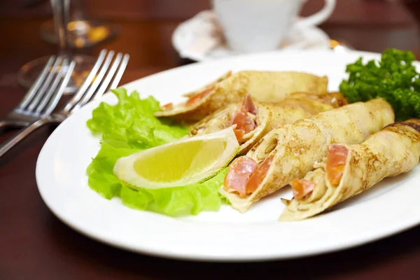 stock image Pancakes with a salmon on a plate