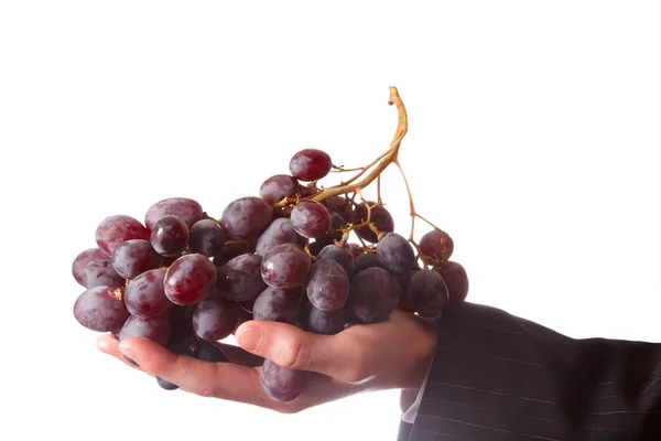 Hand with grape — Stock Photo, Image