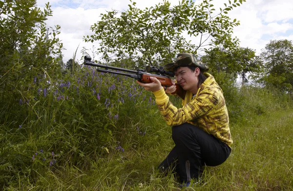 Young hunter shooting up — Stock Photo, Image