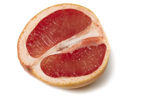 Lyserød grapefrugt halvering - Stock-foto